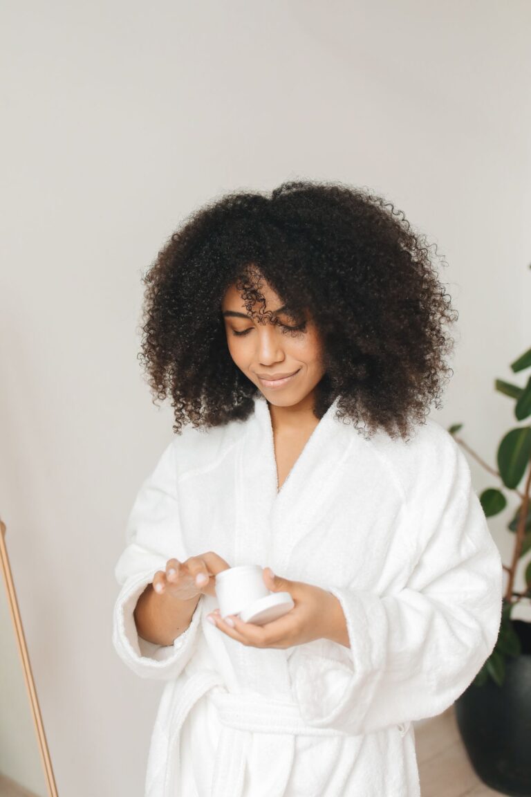 Woman washing her face with foaming cleanser