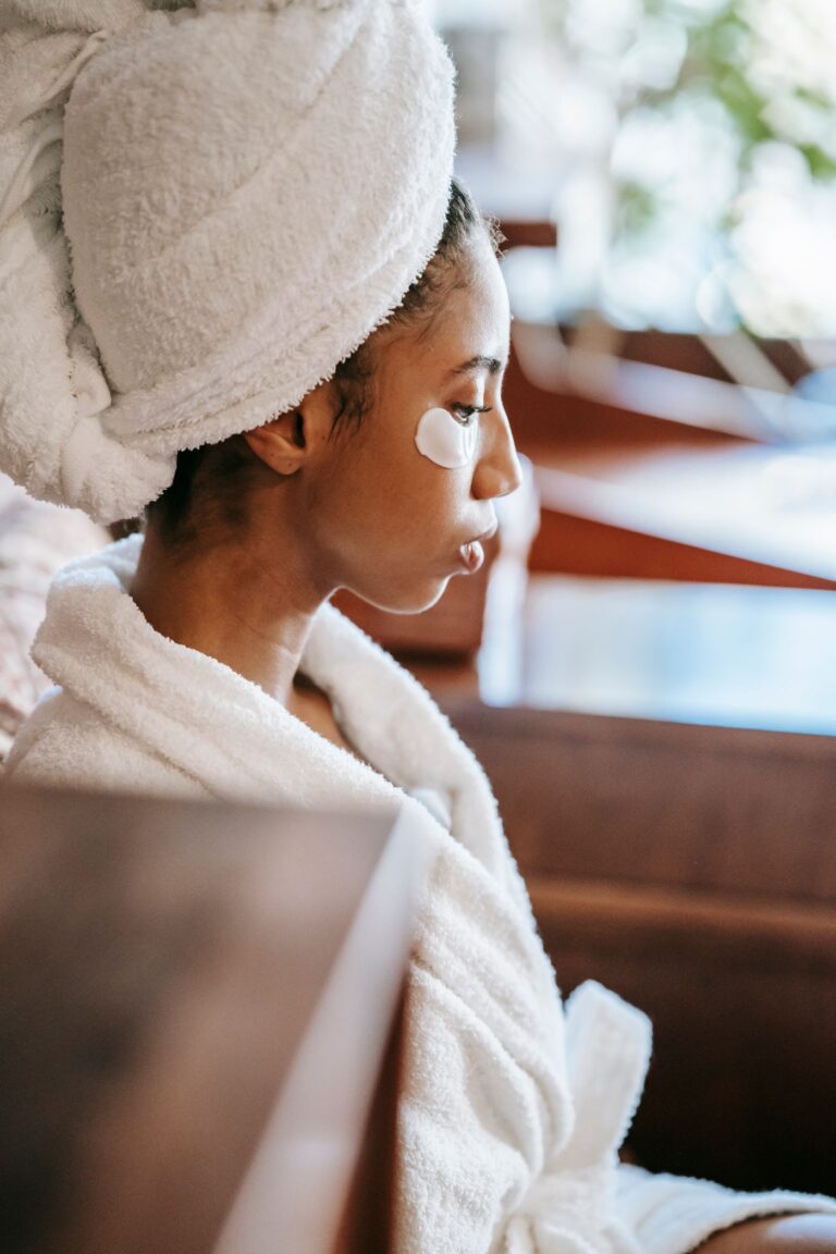 A woman wearing under-eye treatment patches
