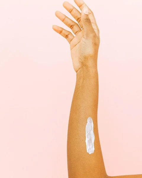 Body lotion on an arm
