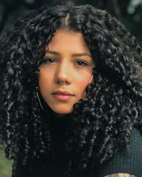 Woman with long defined curls