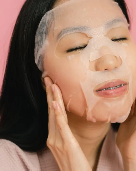 Woman wearing a Korean sheet mask