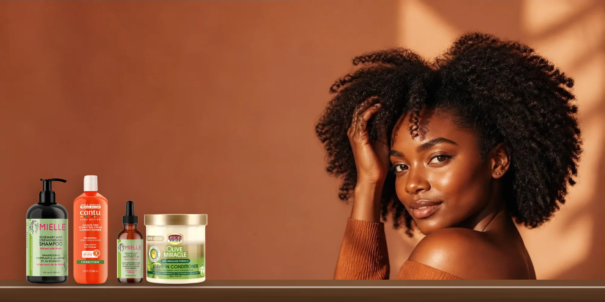 Woman with natural coily hair and original hair care products at Benus Beauty Kenya